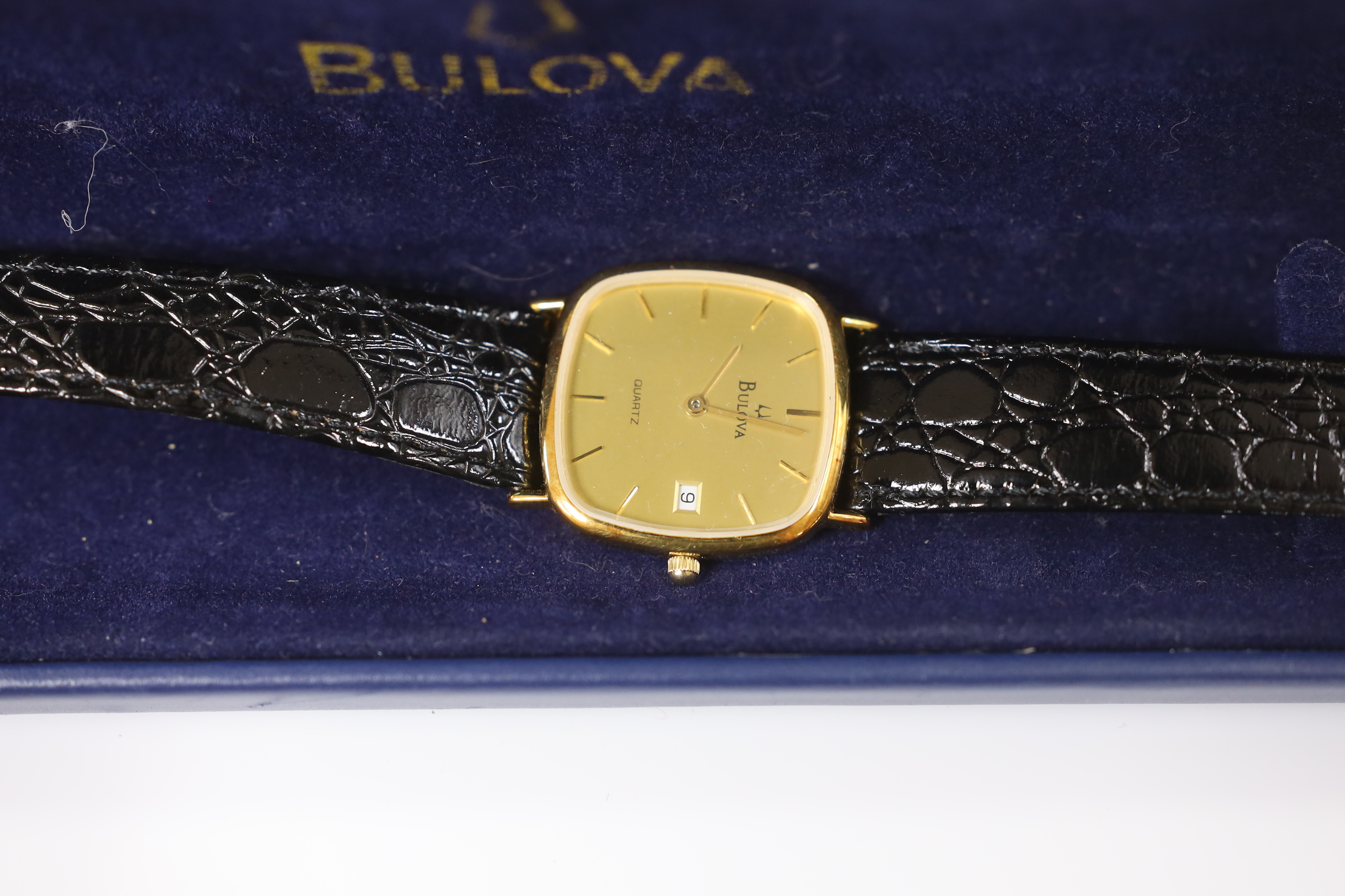 A gentleman's Raymond Weil 18k gold plated quartz dress wrist watch, a similar Bulova steel and gold plated quartz wrist watch and a lady's Smiths Imperial gold plated wrist watch.